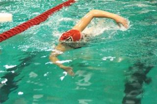 Junior Melinda Blomberg wins the 500 freestyle. Blomberg can often be seen listening to her iPod moments before diving into the pool. According to her coach