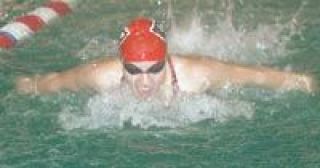Sophomore Kami Girard spreads her wings in the 100-yard butterfly Thursday