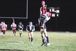 Senior wide receiver Levi Cartas gets a little more height than his defender to catch the ball for a 30-plus yard catch and a big first down in M-Ps comeback attempt in the fourth quarter.