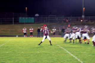 Freshman quarterback Justin Lane winds up and fires. Lane flashed signs of greatness in leading the Cougars over Granite Falls