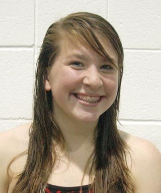 Sophomore Sarah Clark ran over to the scorekeepers station after her record-breaking diving performance and came away a couple of minutes later to tell her teammates and parents