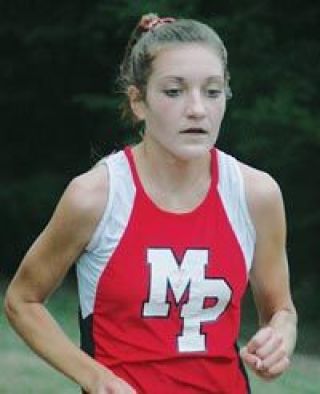 Freshman Kaylie Kimmell has a sheer look of concentration as she races toward a seventh-place overall finish.