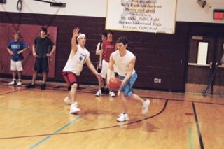 Senior Max Dragitch defends senior Billy Rist during a passing drill.