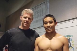 M-P breaststroke record holder Bill Hodgins stands before the record chart with Junior Andy Abadan. Hodgins feels Abadan has the best shot to break the 21-year-old record.