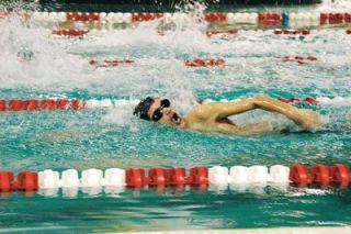Shawn Sewell closes the first leg of a JV 200 freestyle relay. He and his teammates finished the event in 2:18.66.