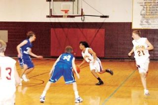 Terrence Ordonez weaves through traffic during Lakewoods game against Sedro-Woolley. Ordonez poured in a game high 25 points for the Cougars.