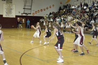 Senior Emily Steinborn looks to feed the post for Lakewood during their Senior Night game against Archbishop Murphy.