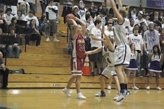Senior guard Nicole Peterson looks for an open teammate as Kamiak applies a full-court press in the games first half.