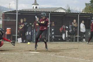 Lakewood outfielder Stephanie Kushner dodges a ball thrown a bit too far inside. Kushner was walked in this at bat