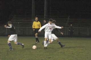 Sophomore Brady Ballew seeks control of the ball in the midfield.
