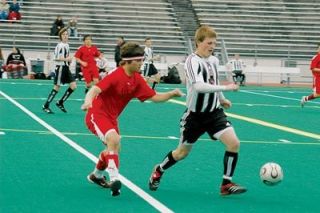 M-P junior forward Jordan Salcedo attempts to dribble the ball away from Cascade midfielder Jason Covert at Everett Memorial Stadium on March 30.