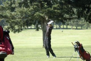 M-Ps Kyle Hanks envisions the arc of his ball as he takes a practice swing. Hanks finished the Snohomish Golf Course with an 85-stroke game