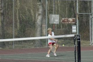 M-Ps number two singles player Jodie Anderson returns an Arlington volley.