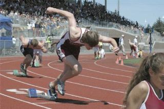 Junior sprinter Devon Smith takes off from the blocks in the boys 400