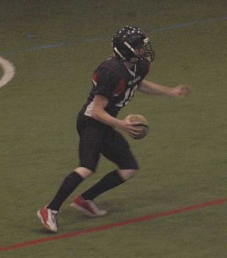 Marysville quarterback Blake McGrew looks for an open receiver in a game at the Snohomish Indoor Soccer Dome.
