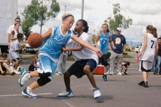 Mackenzie Bretz tries to drive the ball around Myzhanique Ladd. Her Whoop Donkey Junior team struggled early in the match