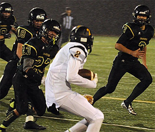 Marysville Getchell defenders close in on a tackle Nov. 6.