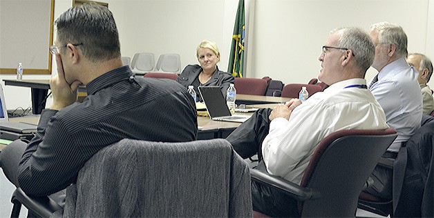 Superintendent Becky Berg listens as school board members and administrators talk about lessons learned from the shooting at Marysville-Pilchuck High School last fall.