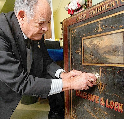 Ken Cage is shown in a file photo by The Herald unlocking a historic safe. He was named grand marshal of the Marysville Strawberry Festival Grand Parade.