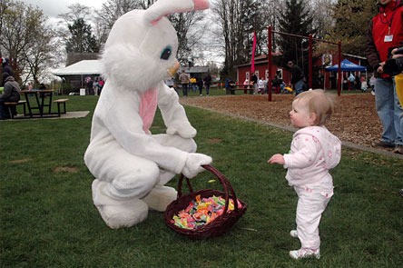 The Easter Bunny is regarded warily by 14-month-old Emma Yancy during her first Easter egg hunt at Jennings Park April 3.