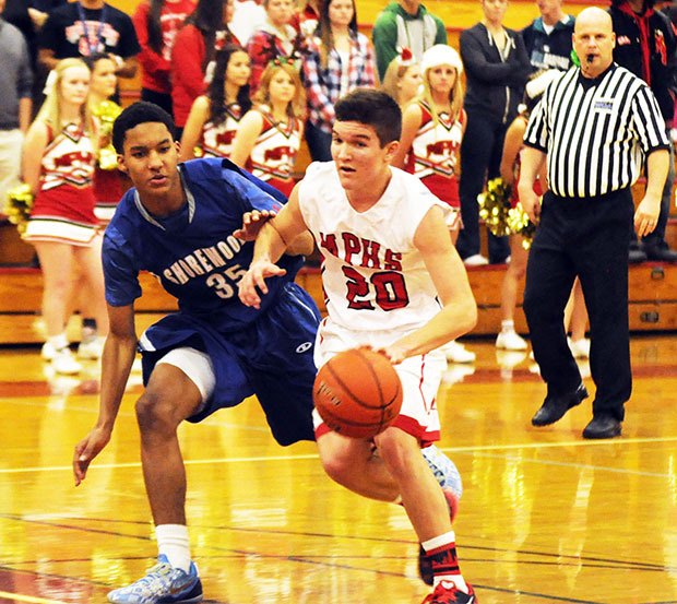M-P's Josh Bevan dribbles toward the basket against Shorewood.