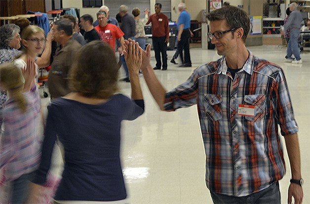 Tim Shaffer and his family have fun learning to square dance at Totem Middle School Sept. 21. Another free lesson will take place Sept. 28 from 7-9 p.m.