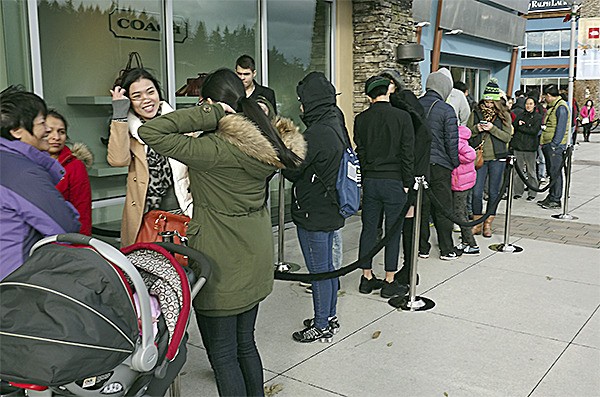 About 50 people lined up at Coach at the Seattle Premium Outlet stores in Tulalip at 10 Thanksgiving morning.