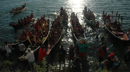 Nine canoe crews arrive on the shores of Tulalip Bay July 11 as part of the 21st annual tribal canoe journey heading to Neah Bay.