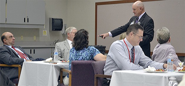 National education consultant John Draper talks to community leaders at lunch Sept. 8 on 'The Inside Scoop About Public Schools.' Earlier in the day he gave a similar speech to the district's teachers.