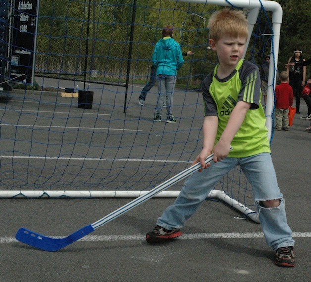 Nathaiel Jackson gives street hockey a try during the Marysville Family YMCA’s Healthy Kids Day on April 26.