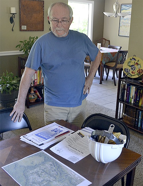 Marshall Parker of Marysville looks over a map