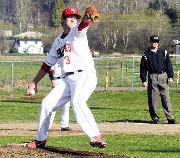 A Marysville-Pilchuck pitcher about to deliver a pitch.