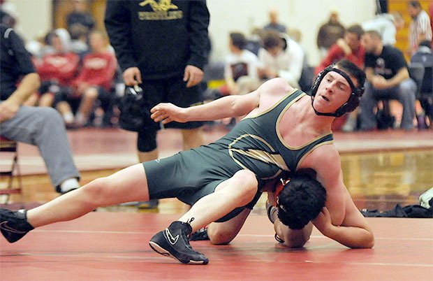 Chris Johnson of Marysville Getchell wraps up foe in a double dual Dec. 17.
