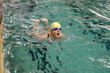 Freshman swimmer Briaunna Heacock takes a deep breath as she reaches the end of a lap during practice.