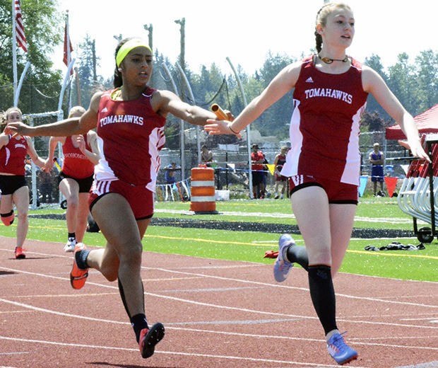 Marysville-Pilchuck's Trina Davis passes the baton.