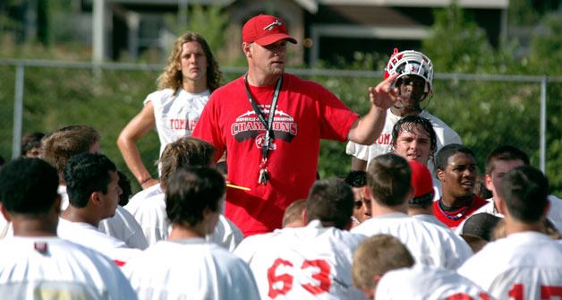 Marysville-Pilchuck head coach Brandon Carson instructs his team on what it will take to three-peat in the Wesco North .
