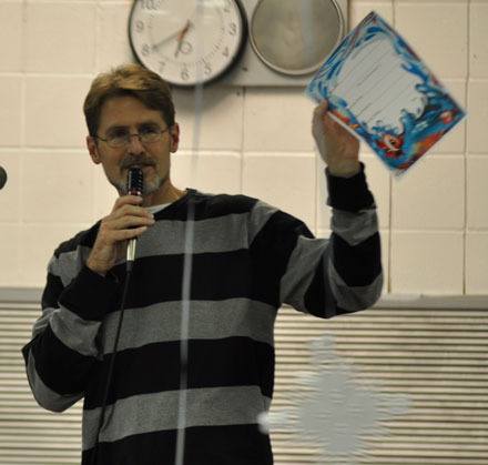 Marysville-Pilchuck High School Life Skills teacher Jim Strickland entertains the crowd at the M-P Life Skills Holiday Silent Auction on Dec. 10.