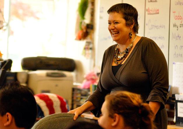 Marysville Middle School science teacher Wanzellia Clark teaches her sixth-grade class. Clark was diagnosed with breast cancer in 2011.
