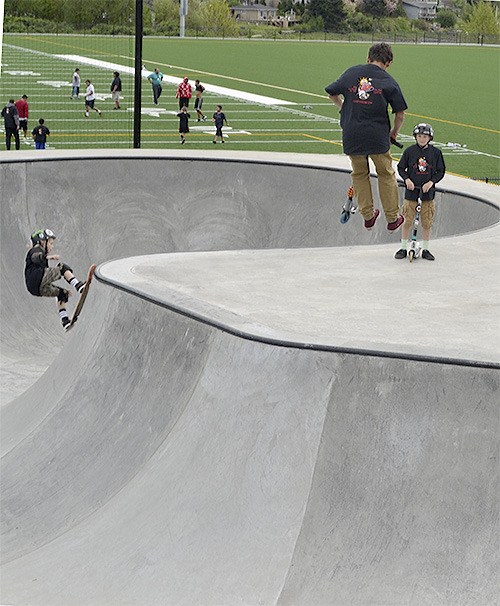 Scooter riders catch air at the new skatepark in Tulalip. A grand opening for that park and a softball field right next to it took place April 14.
