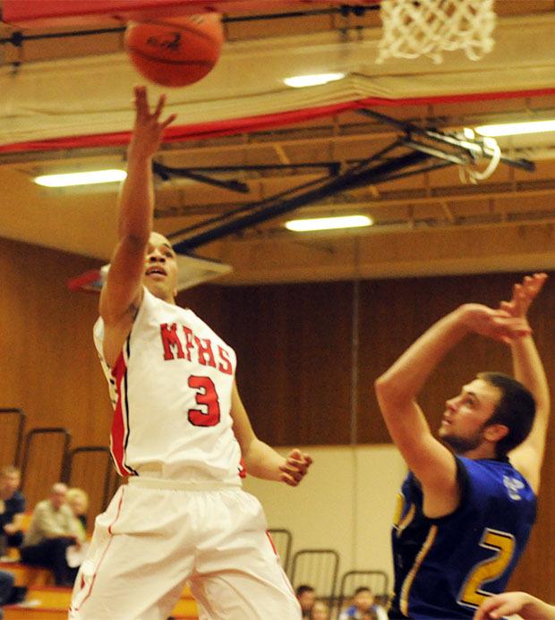 Marysville-Pilchuck's Bryce Juneau goes for layup.