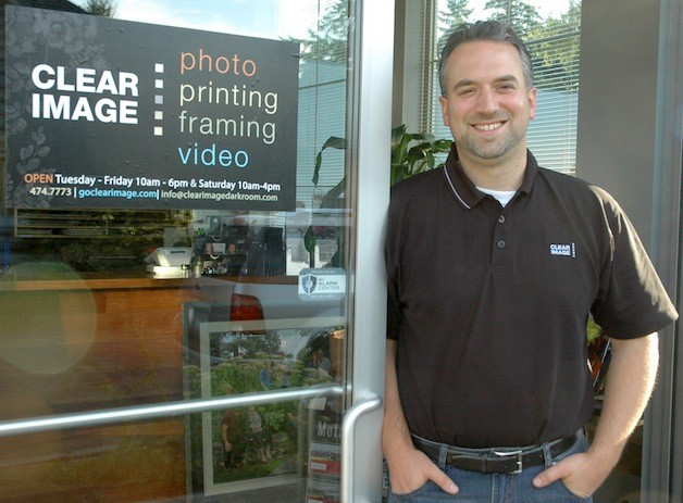 Owner Daniel Jolly welcomes customers to Clear Image Portrait Studio's new location at 1331 State Ave. in Marysville.