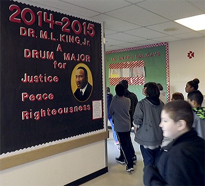 Cedarcrest Middle School students walk by a display in the hallway on Martin Luther King Jr. Jan. 14. They had just attended an assembly with Snohomish County Executive John Lovick as the guest speaker.