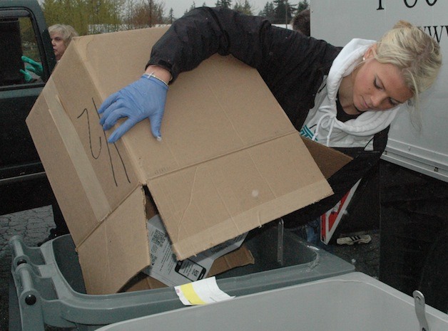 Arlington High School Class of 2012 graduate Makenzie Milless helped load the bins for last year’s community Shred-A-Thon.