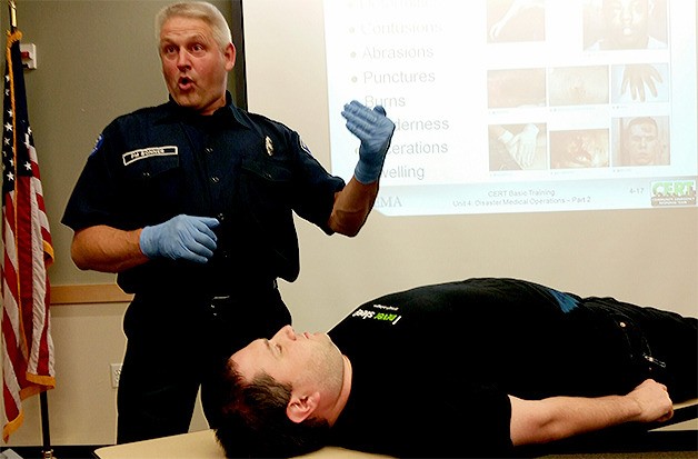 Marysville Fire Department firefighter-paramedic Steve Bonner explains how to do a head-to-toe examination.