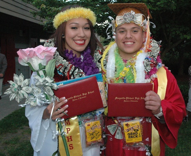 Marysville-Pilchuck High School Class of 2013 graduates Marliah and Justice Napeahi proudly show off their diplomas on June 7.