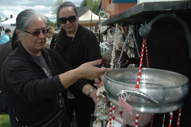 Doreen and Nicole Sieminski check out hand-crafted wind chimes at The Vintage Violet's 'Dreaming Vintage' outdoor market on May 10.