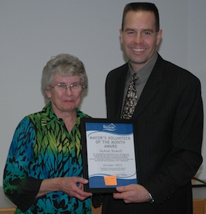 Marysville Community Food Bank Volunteer Coordinator JoAnn Sewell is honored by Marysville Mayor Jon Nehring as the city of Marysville's Volunteer of the Month for October