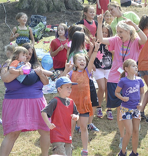 Part of the crowd dances June 8 at Jennings Park as part of the first Children's Concert put on by the city. More than a few hundred people attended.