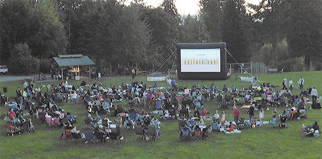 Dozens of families watch the start of the movie 'Minions' at Jennings Park in Marysville July 16. The free movies are provided by the city and popcorn