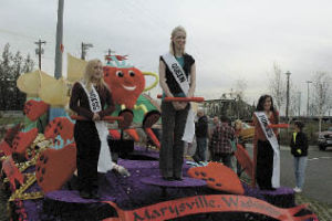 The recently selected Royalty Pageant winners test out their spots on the 2008 Strawberry Festival float. From left are Princess Che Renouard